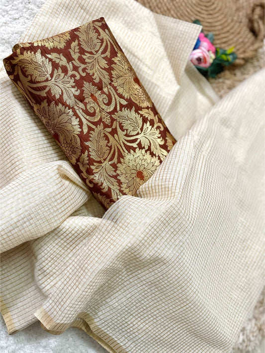 Beautiful semi chanderi silk saree with gold zari checks paired with brown Banarasi brocade blouse