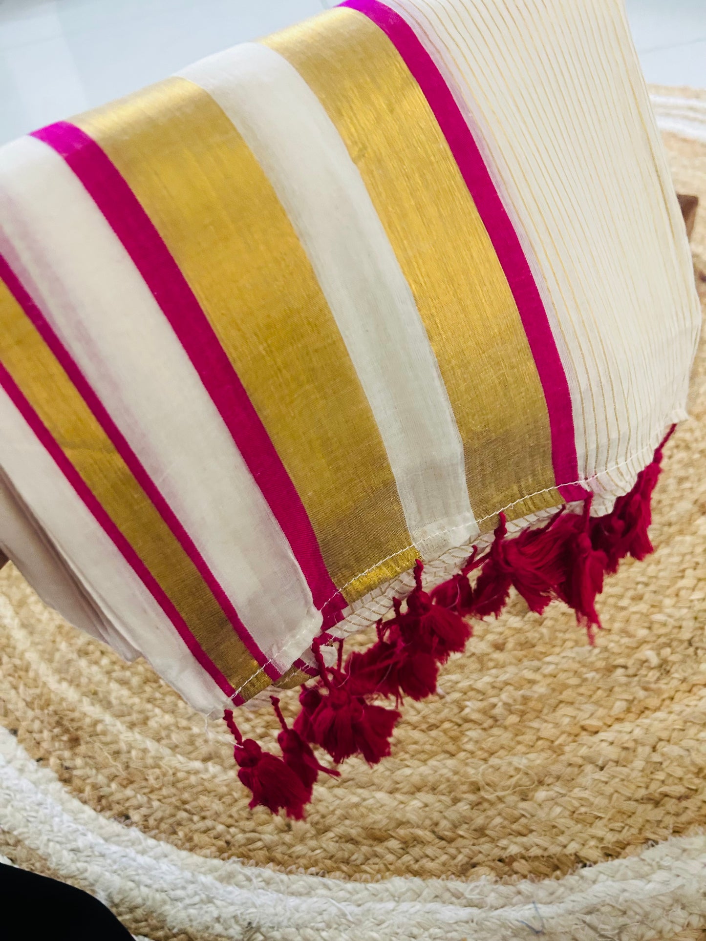 Pure and authentic mul cotton saree with zari stripes all over body and pink zari border