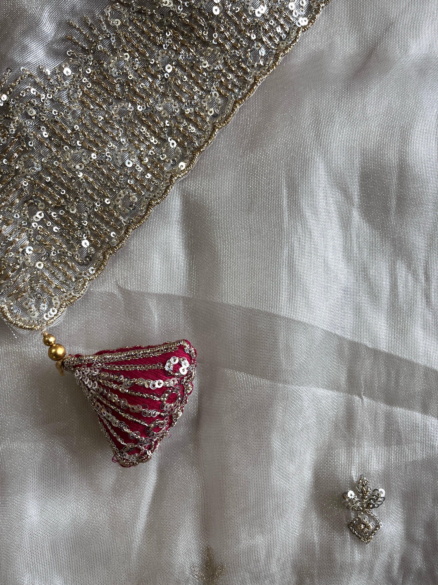 Silver tissue saree with handwork and pink blouse