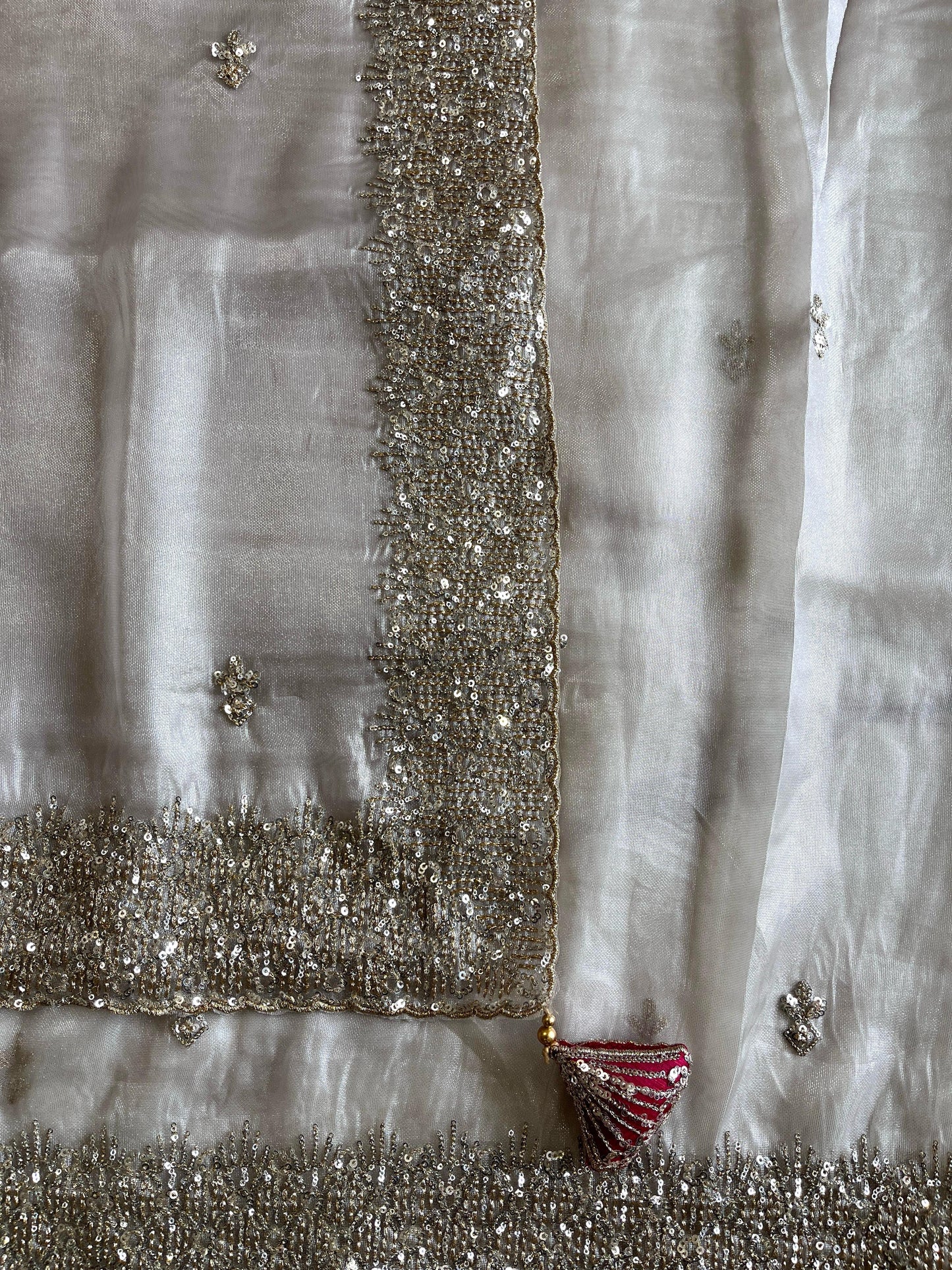 Silver tissue saree with handwork and pink blouse