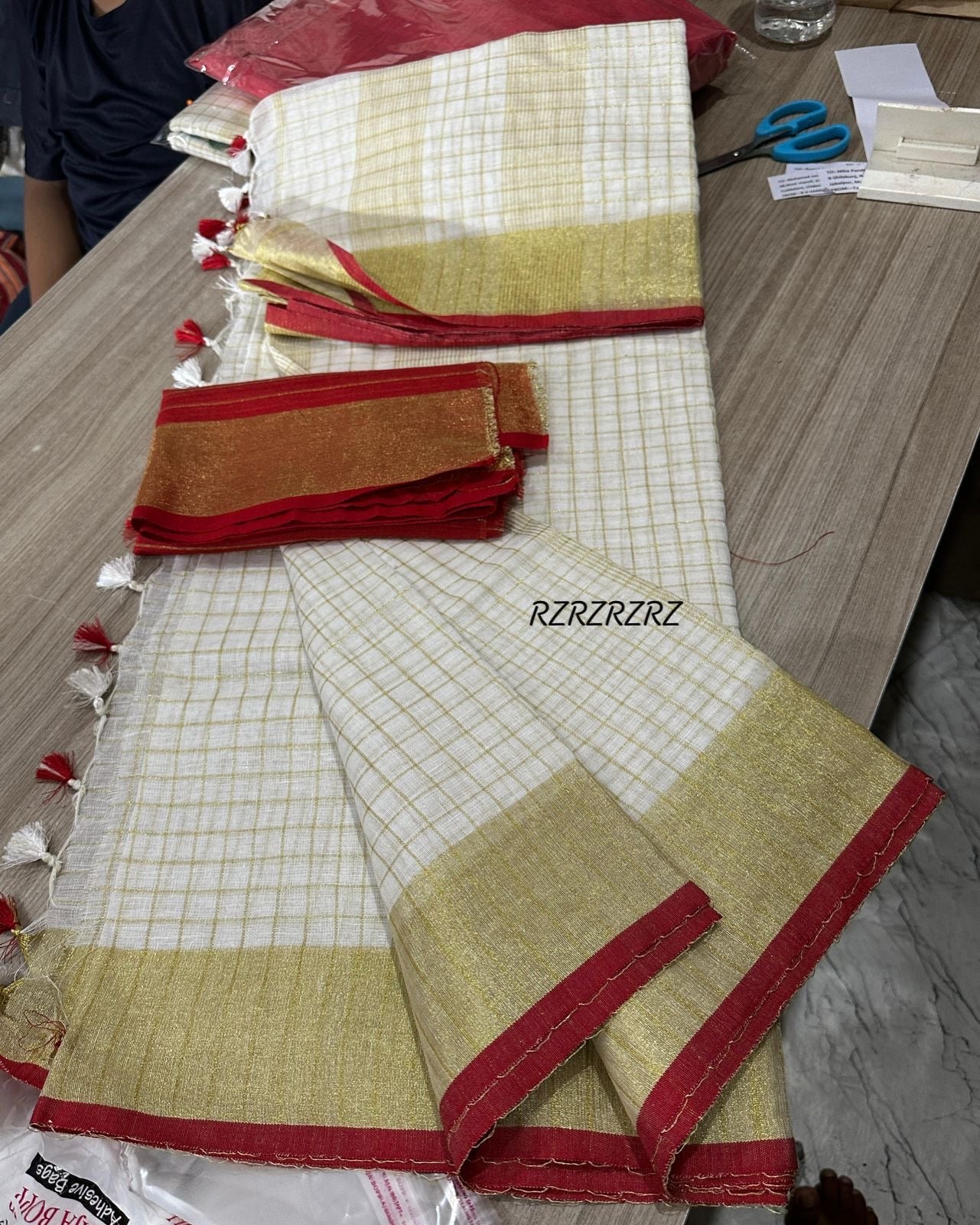 Pure linen checks saree with contrast blouse