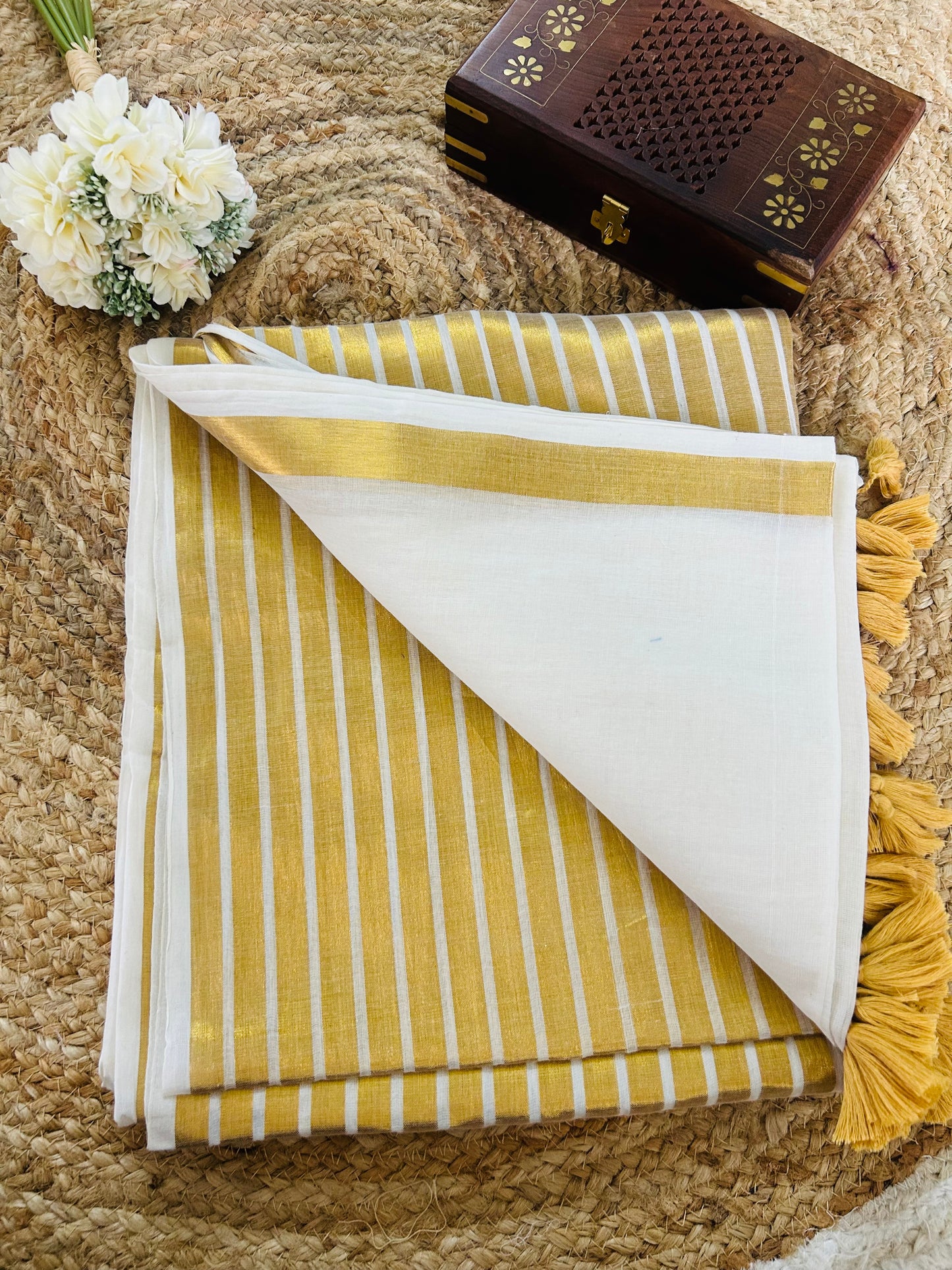 Pure and authentic mul cotton saree with broad gold zari line border on one side and small border on other side