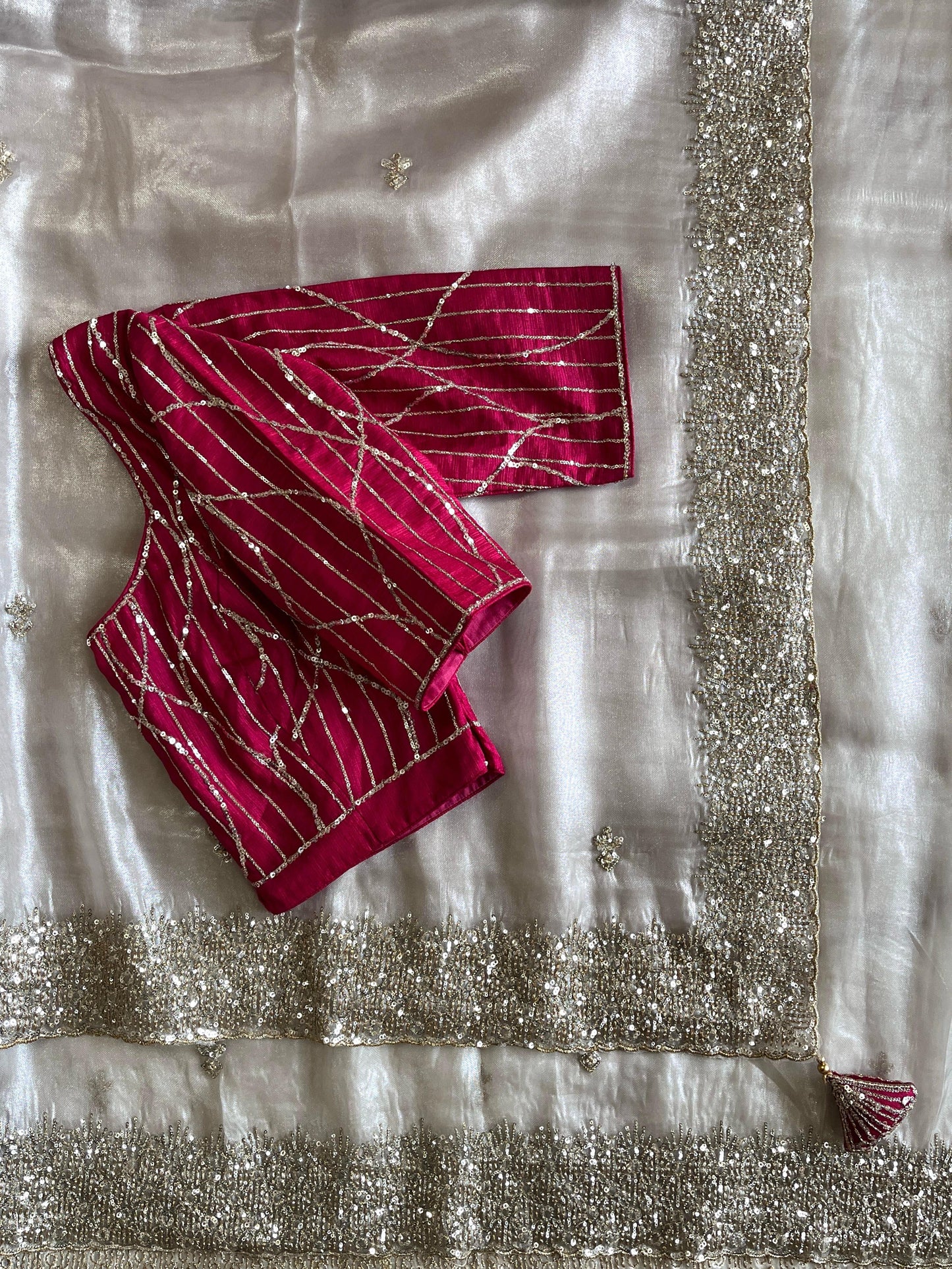 Silver tissue saree with handwork and pink blouse