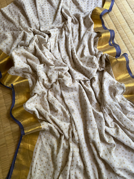 Pure authentic Mul Cotton saree adorned with delicate gold polka dots and a rich zari border for timeless festive elegance.