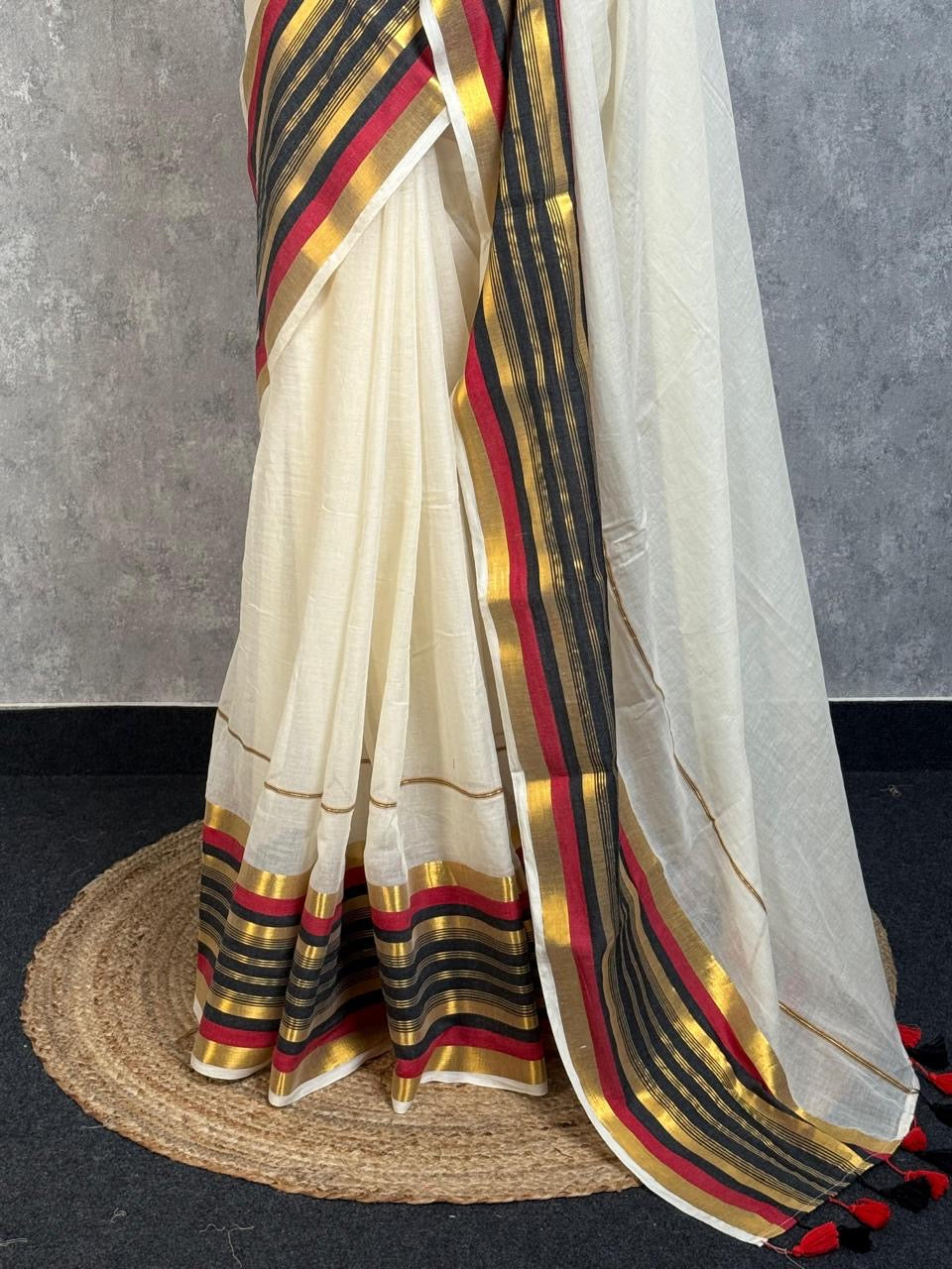 Pure and authentic mul cotton saree with black and red zari border