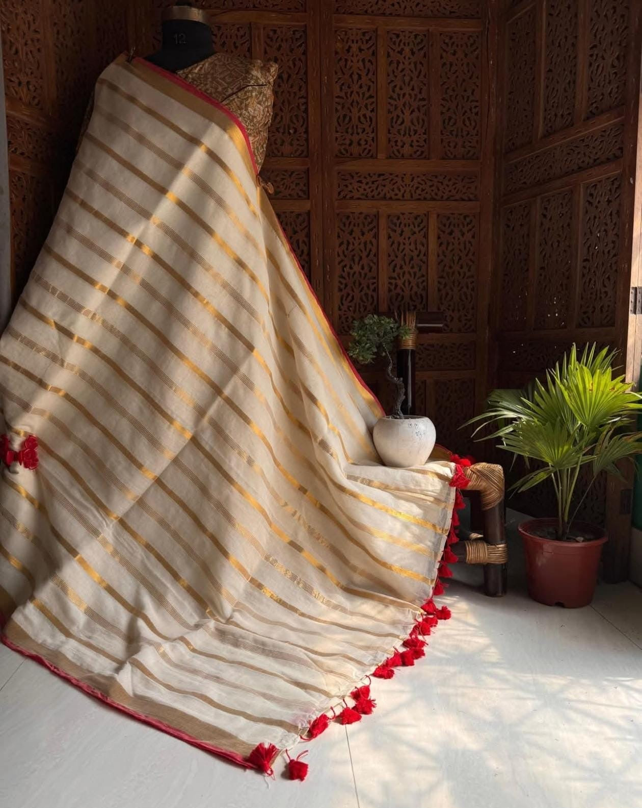 Beautiful pure authentic mul cotton saree with zari stripes and red border