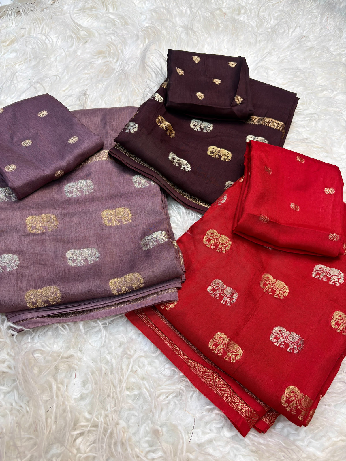 Soft viscous dola silk with beautiful silver and gold elephant motifs in the middle