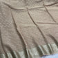 Soft Viscous georgette saree in beige shade with small beautiful jacquard buttas and contrast blouse
