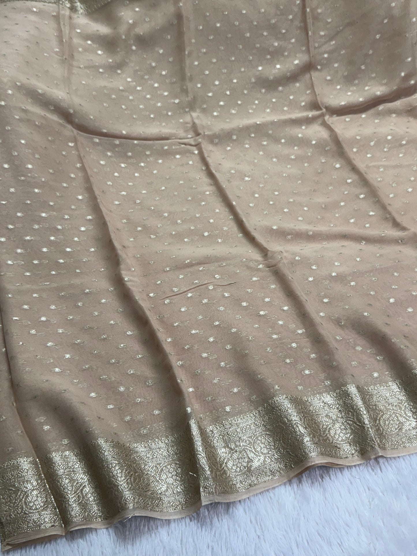 Soft Viscous georgette saree in beige shade with small beautiful jacquard buttas and contrast blouse
