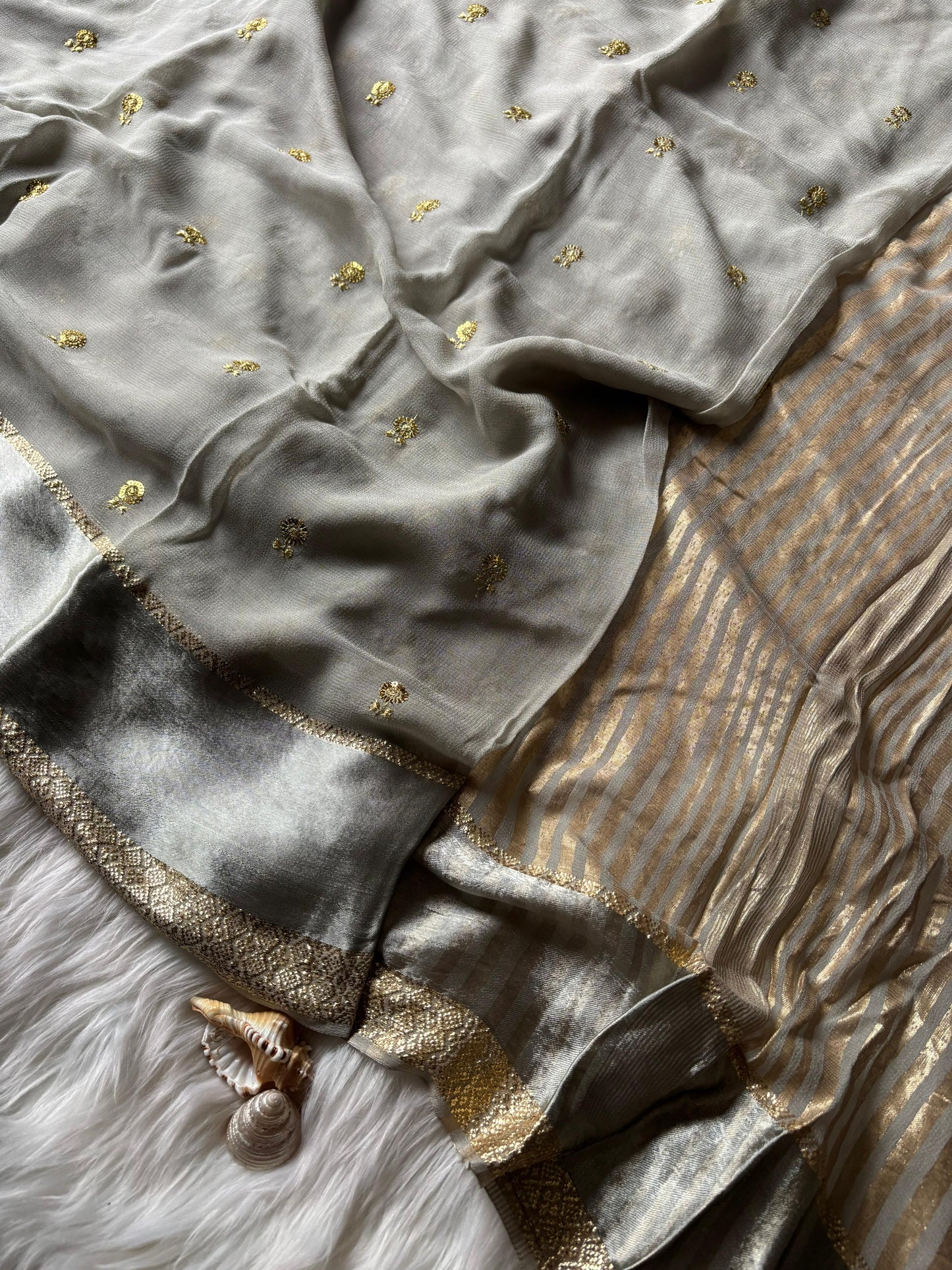 Pure georgette viscous saree with rich satin border and tiny flower buttas
