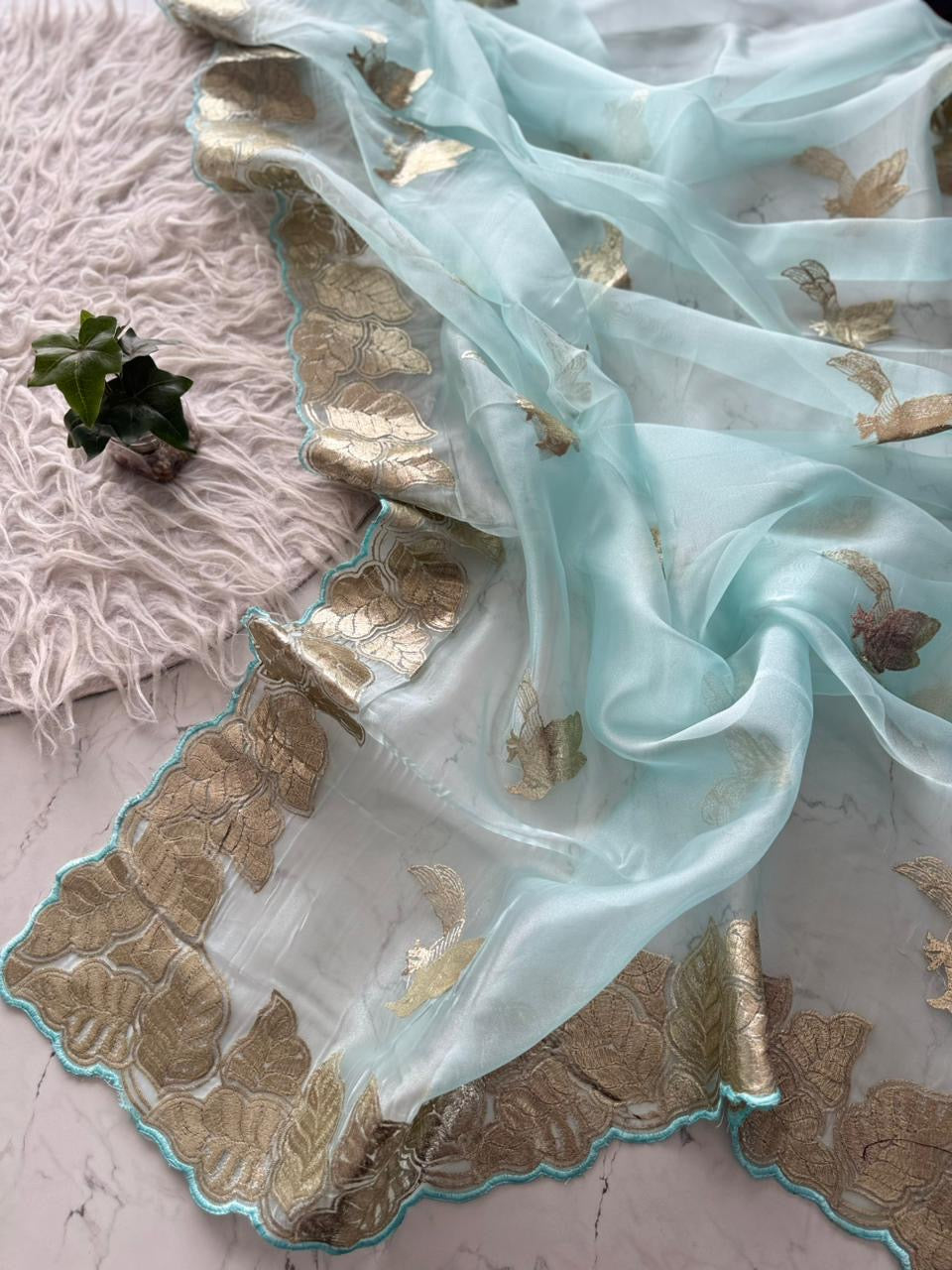 Beautiful semi organza saree with gold zari pitta work border and scalloped edges