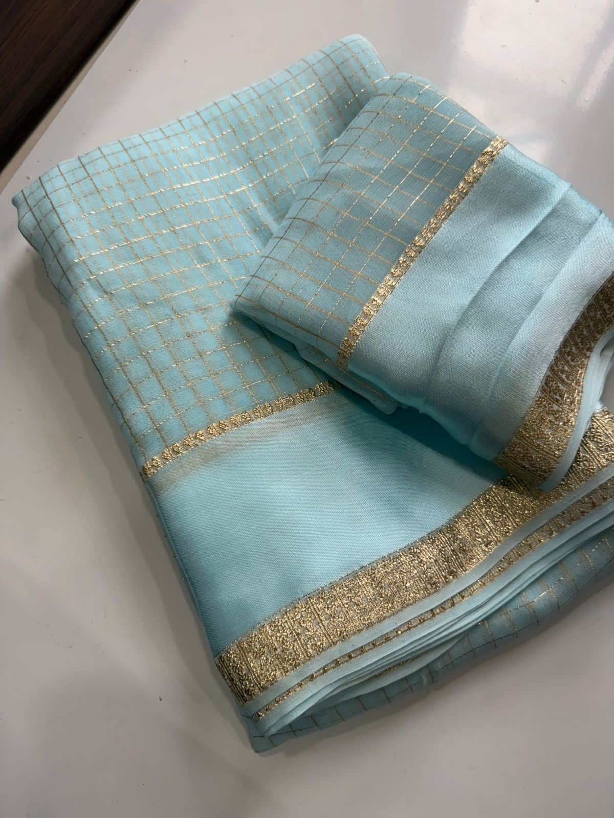 Beautiful viscous georgette saree with checks body and running blouse