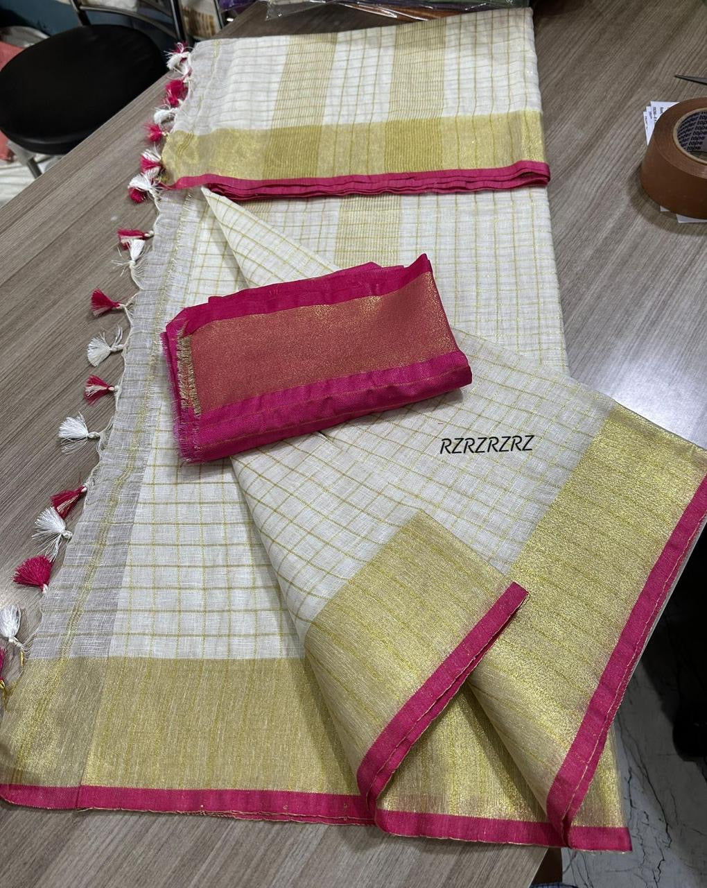 Pure linen checks saree with contrast blouse