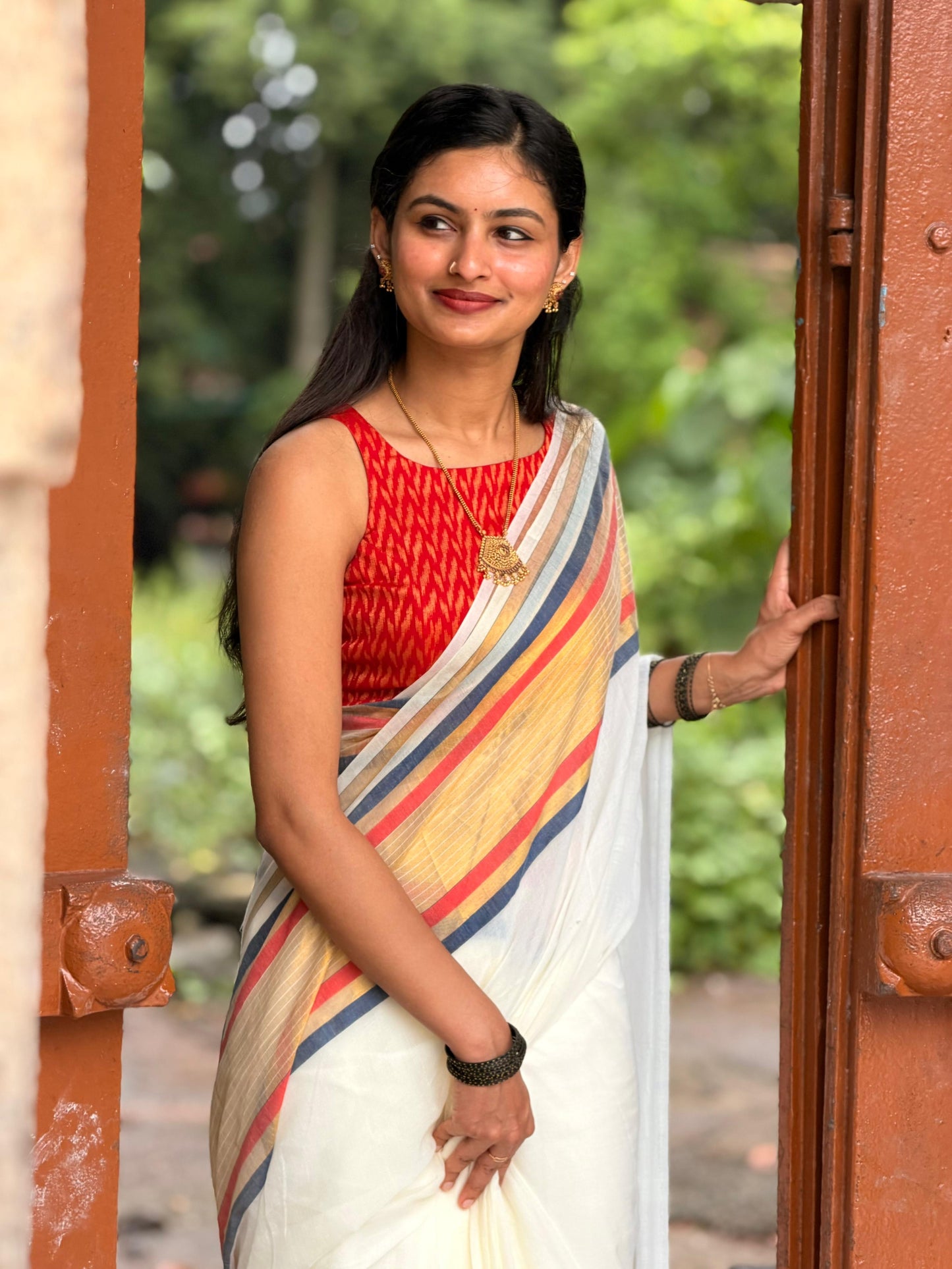 Soft mul cotton saree with beautiful red and black zari stripes border