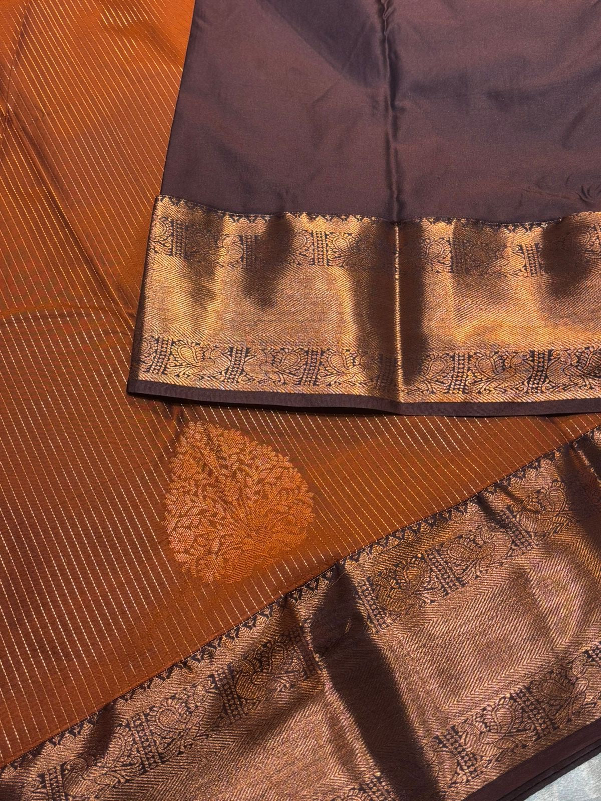 Beautiful premium rust orange semi silk saree with copper zari stripes and border