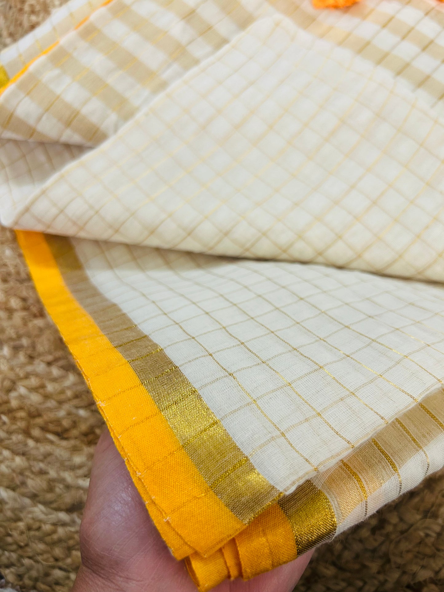 Pure and authentic mul cotton saree with zari checks all over and small mango yellow zari border