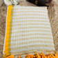 Pure and authentic mul cotton saree with zari checks all over and small mango yellow zari border