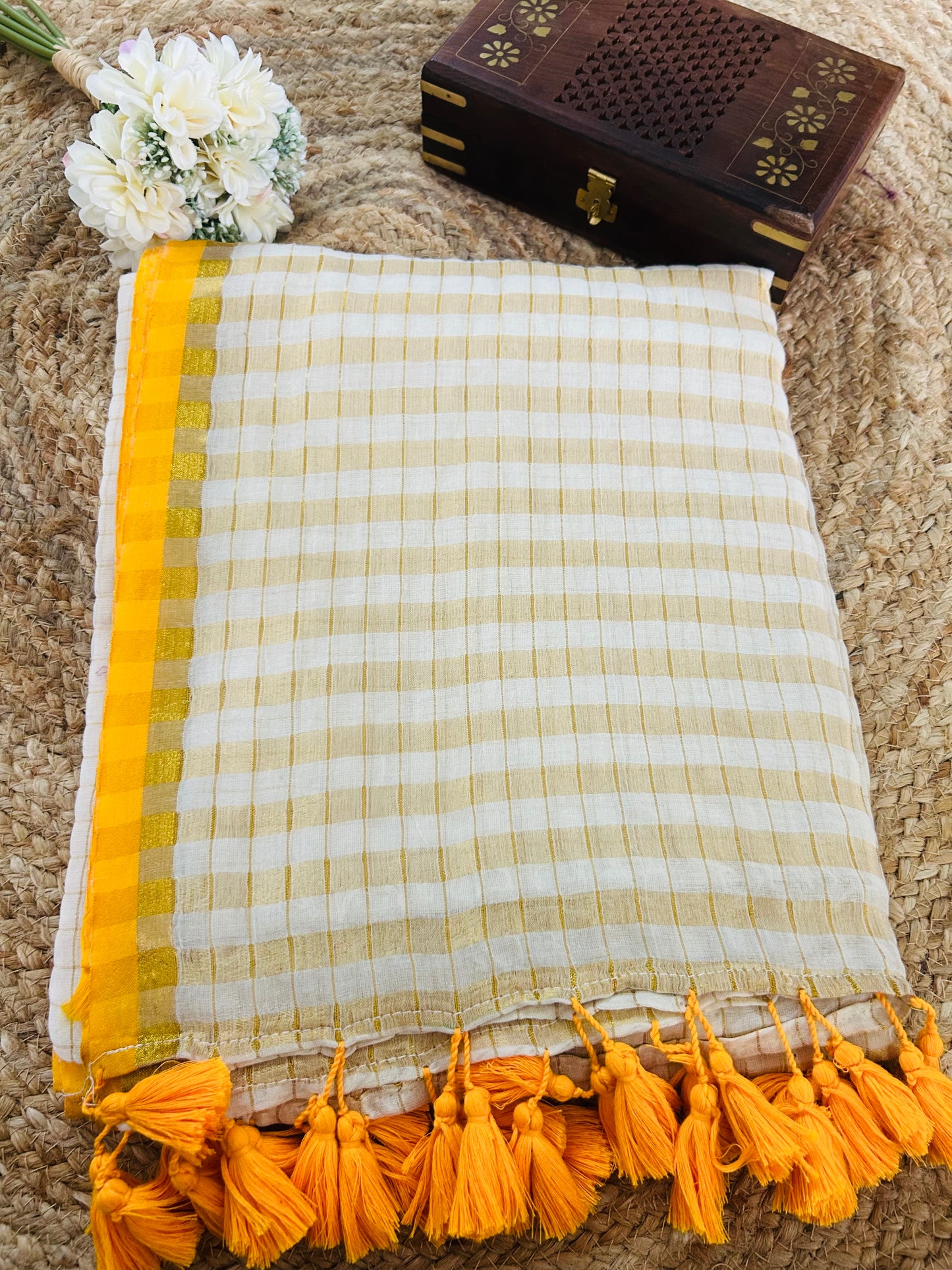 Pure and authentic mul cotton saree with zari checks all over and small mango yellow zari border