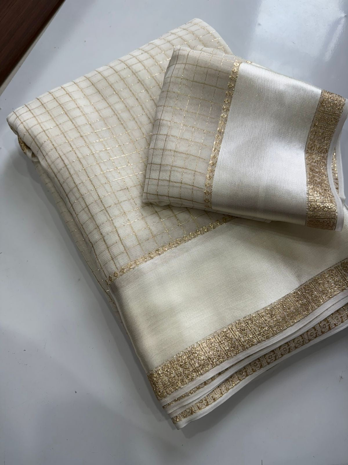 Beautiful viscous georgette saree with checks body and running blouse