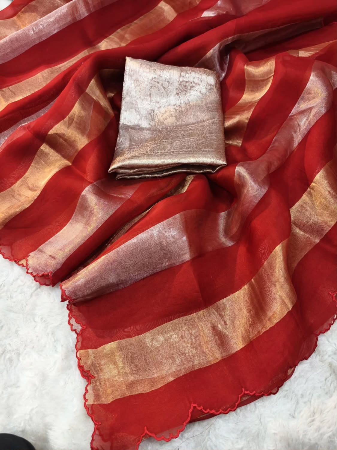 Beautiful georgette tissue silk saree with gold and silver tissue patta