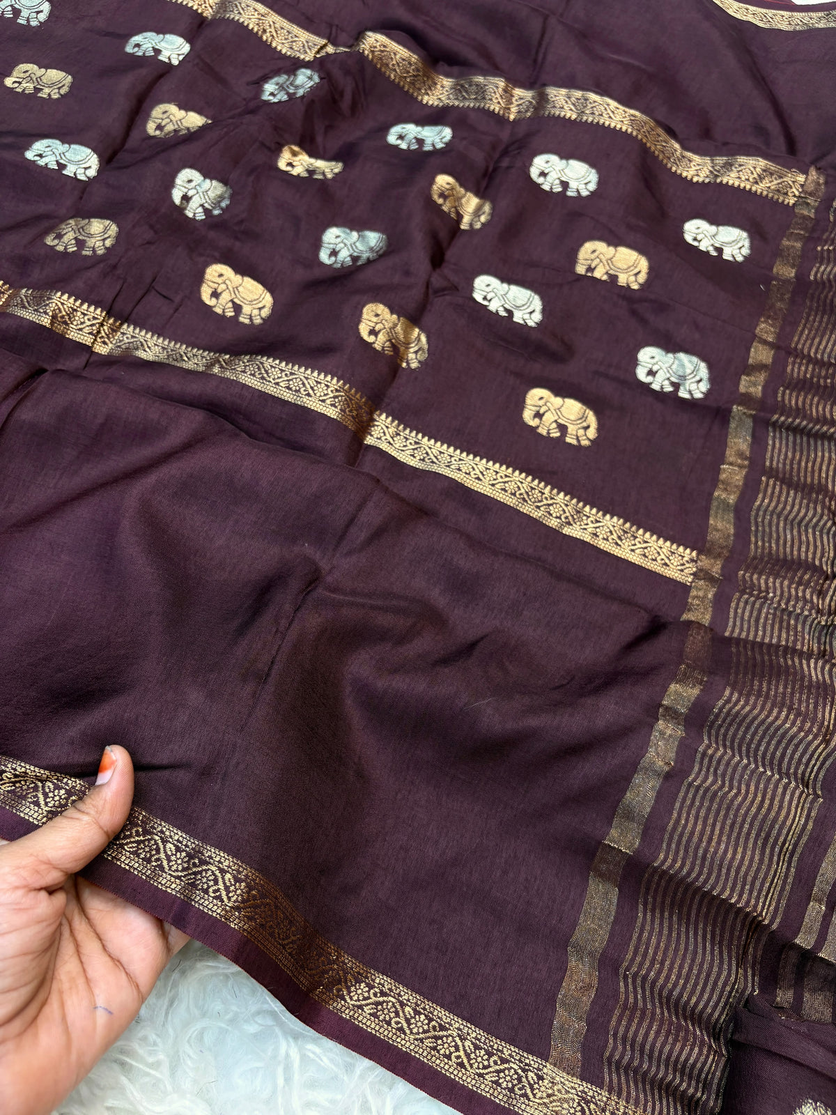 Soft viscous dola silk with beautiful silver and gold elephant motifs in the middle