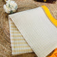 Pure and authentic mul cotton saree with zari checks all over and small mango yellow zari border