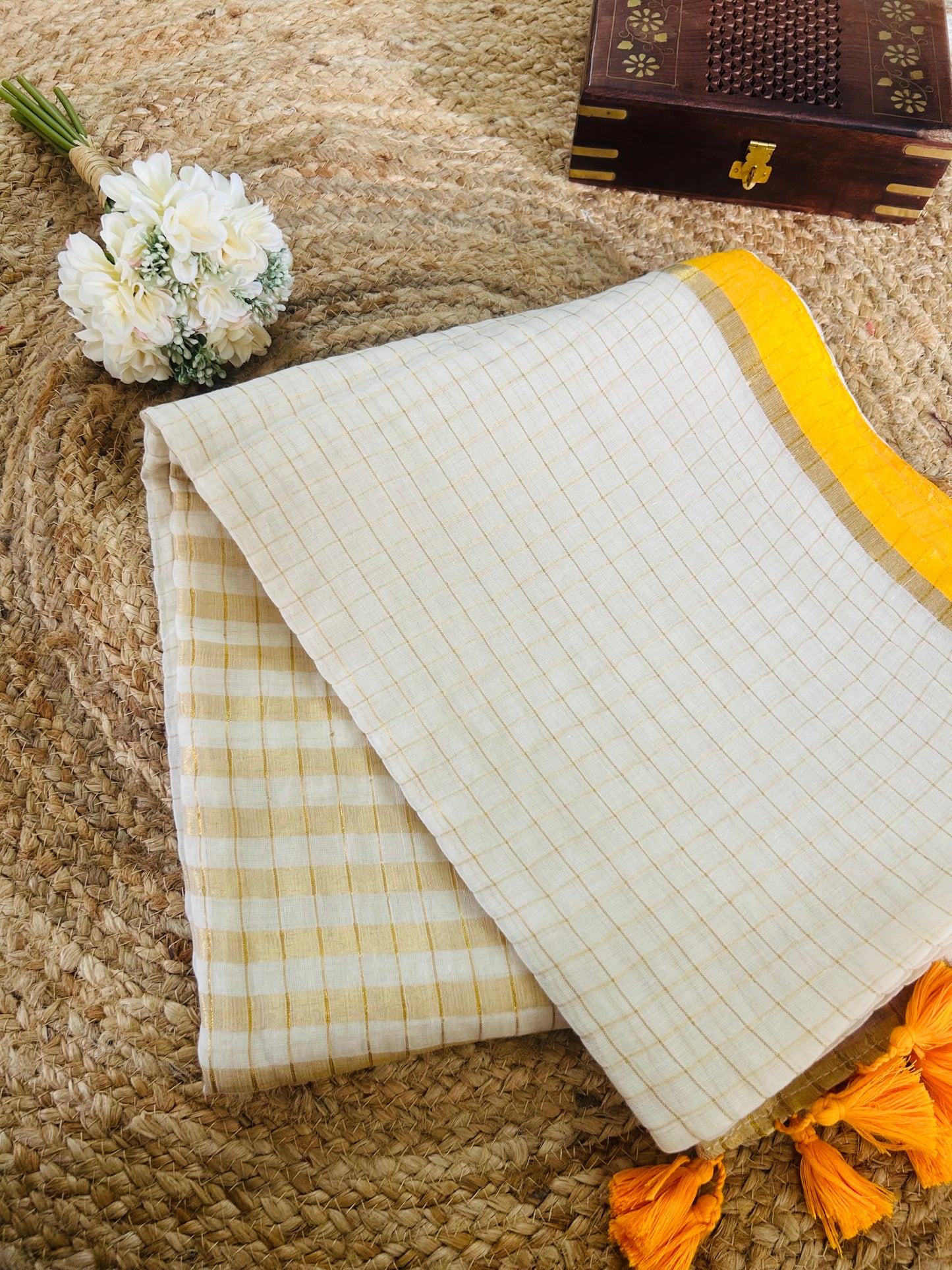 Pure and authentic mul cotton saree with zari checks all over and small mango yellow zari border