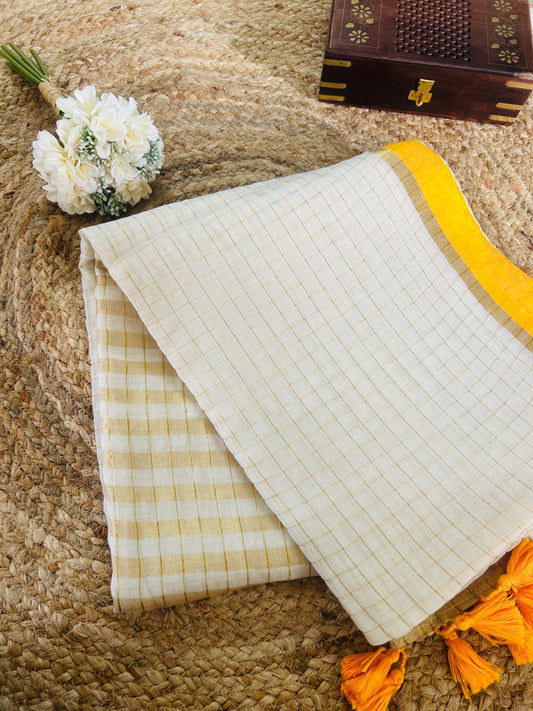 Pure and authentic mul cotton saree with zari checks all over and small mango yellow zari border