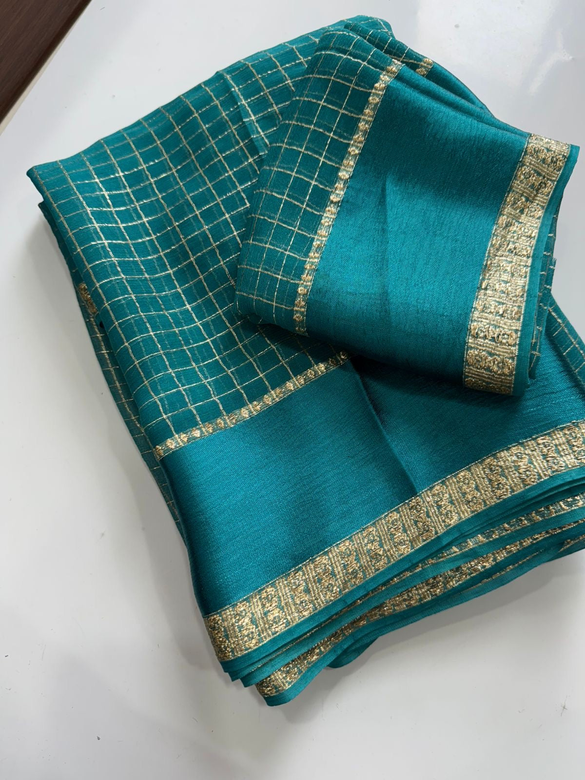 Beautiful viscous georgette saree with checks body and running blouse
