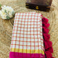 Pure and authentic mul cotton saree with pink zari checks and small border
