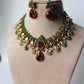 A stunning regal choker set adorned with ruby red stones, pearls, and emerald accents.