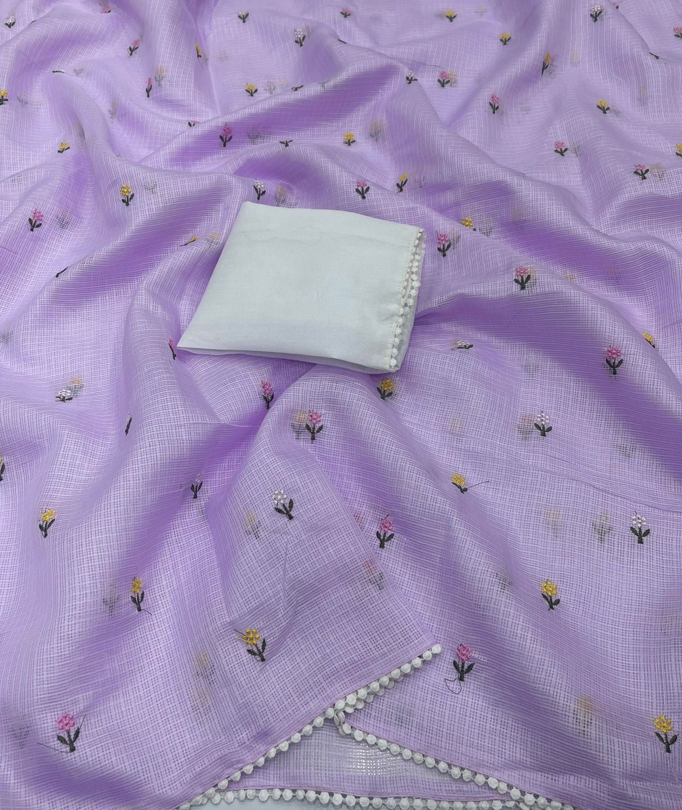 Soft kota saree with small floral butta embroidered body and lace border..