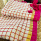 Pure and authentic mul cotton saree with pink zari checks and small border