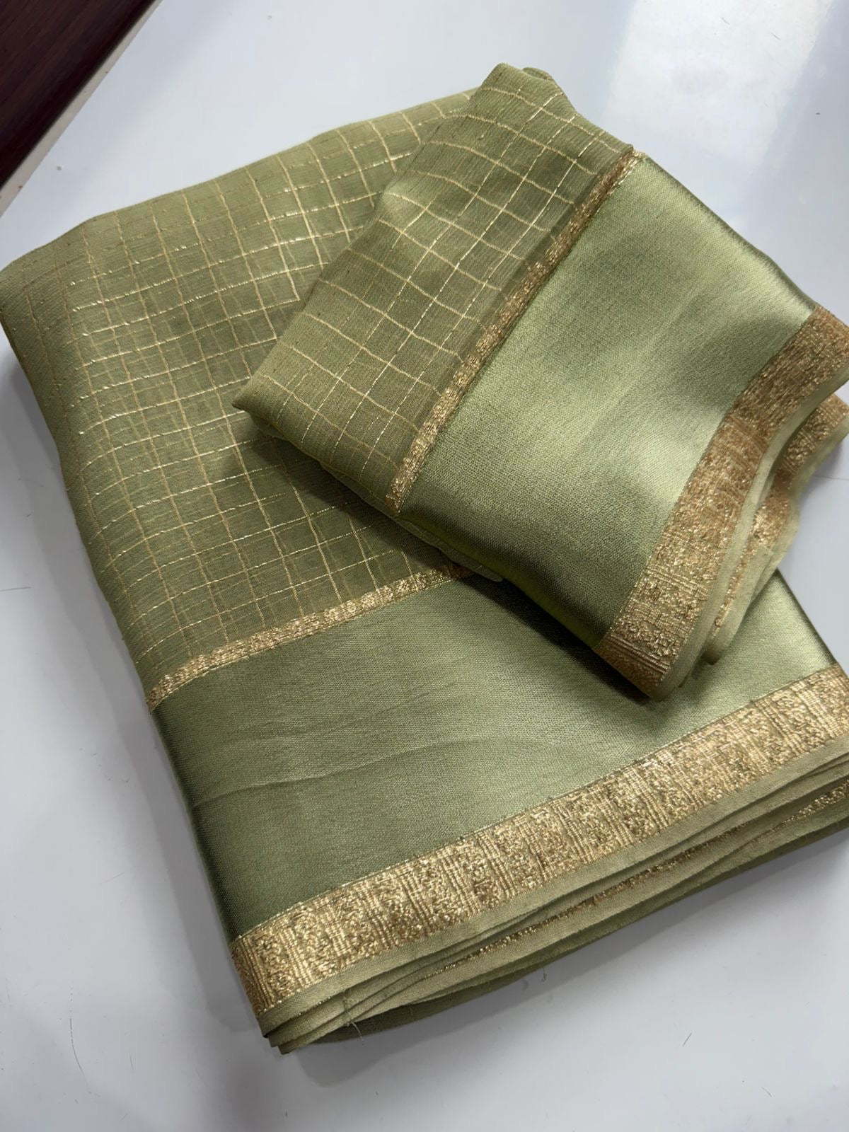 Beautiful viscous georgette saree with checks body and running blouse