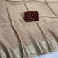 Soft Viscous georgette saree in beige shade with small beautiful jacquard buttas and contrast blouse