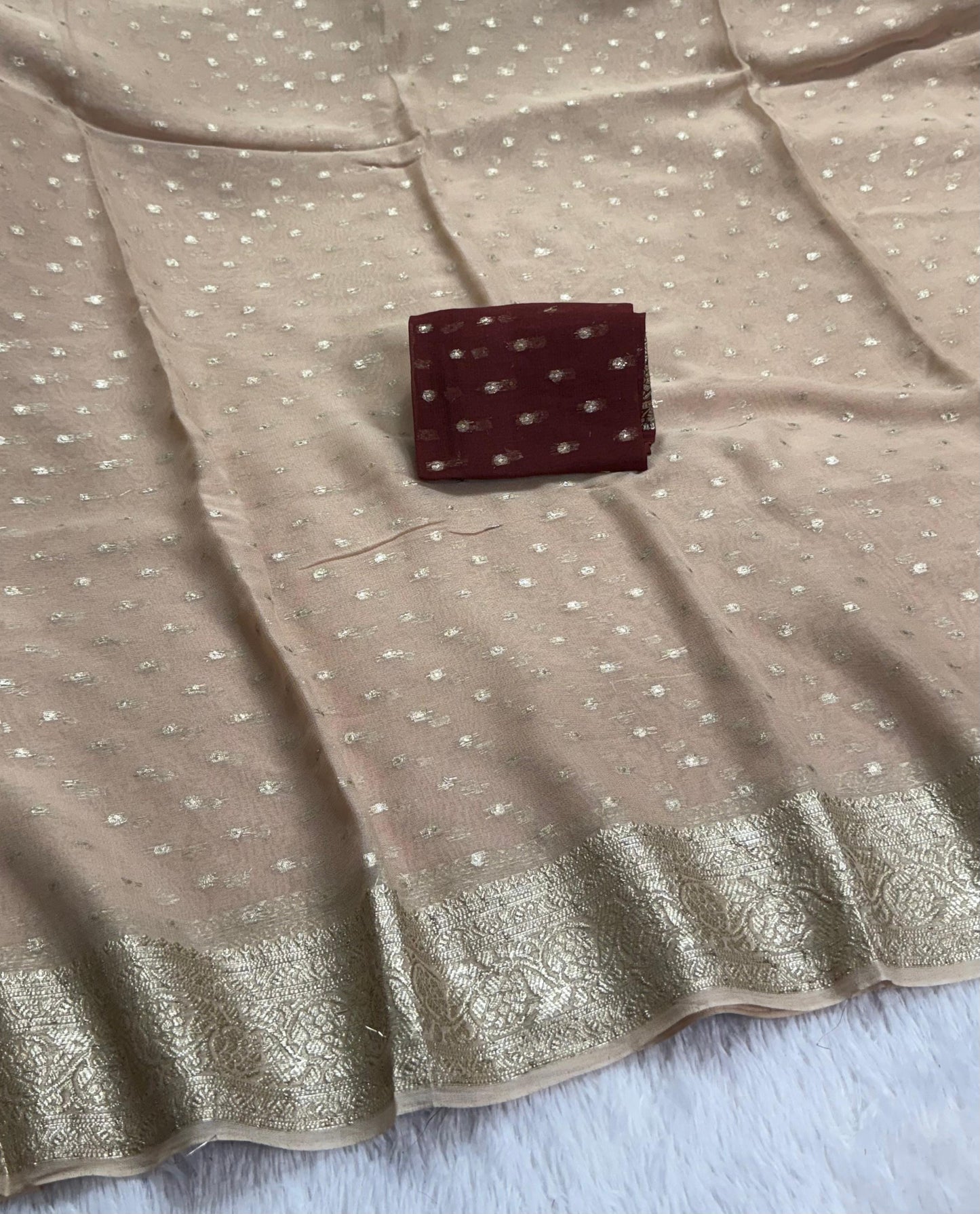 Soft Viscous georgette saree in beige shade with small beautiful jacquard buttas and contrast blouse