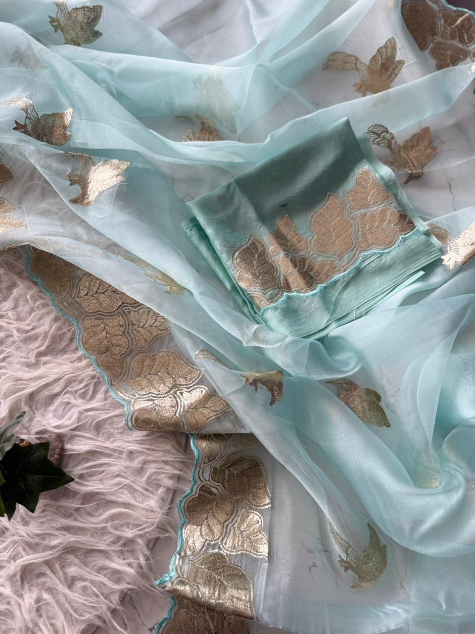 Beautiful semi organza saree with gold zari pitta work border and scalloped edges