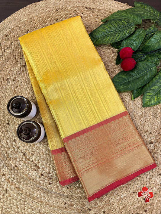 Banarasi tissue kanchi style yellow saree with contrast red border