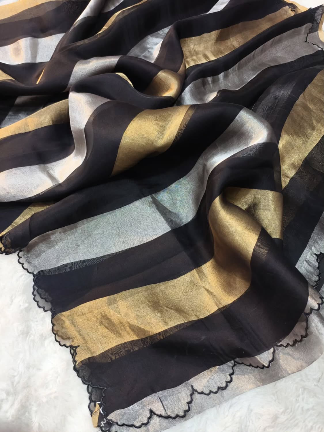 Beautiful georgette tissue silk saree with gold and silver tissue patta