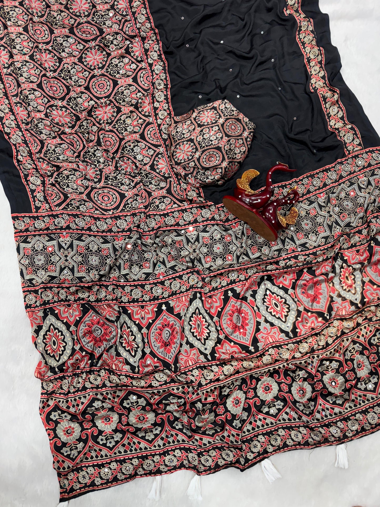 Soft and beautiful crepe silk saree with ajrakh prints and mirror work