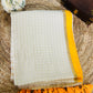 Pure and authentic mul cotton saree with zari checks all over and small mango yellow zari border