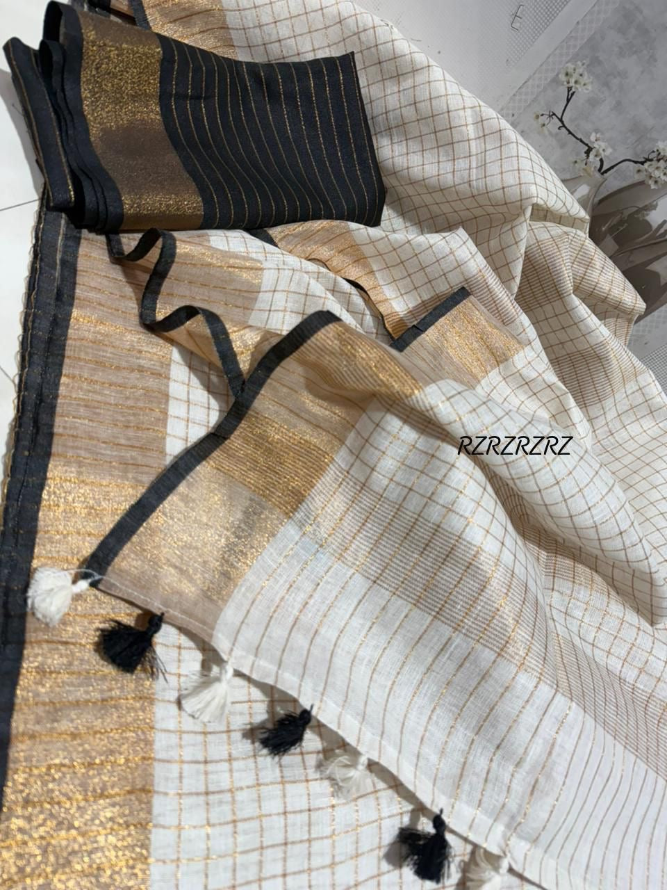 Pure linen checks saree with contrast blouse