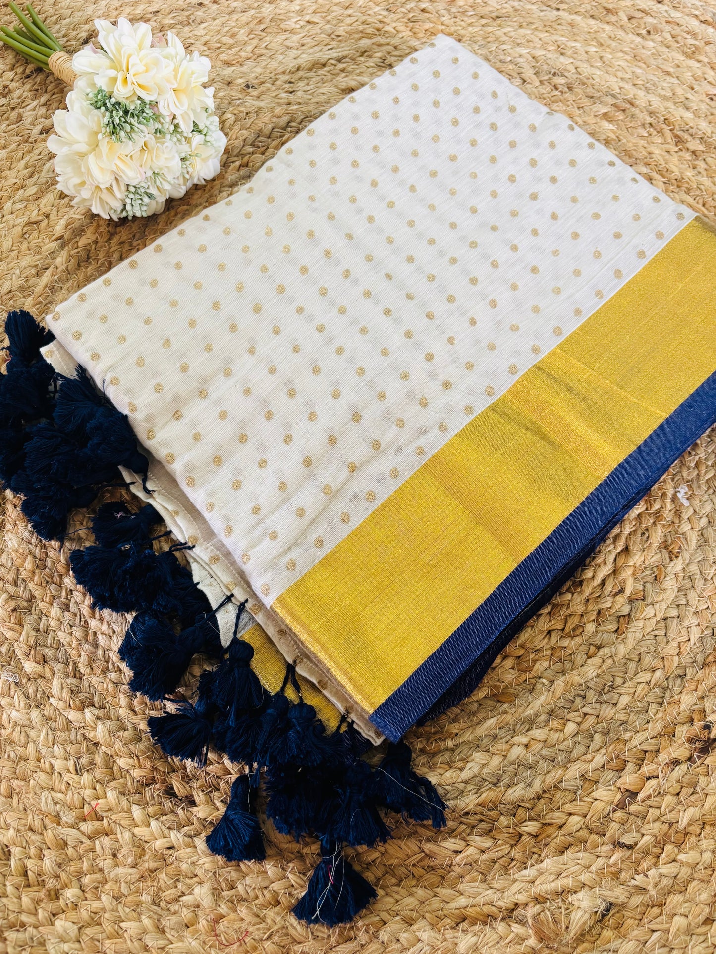 Pure authentic Mul Cotton saree adorned with delicate gold polka dots and a rich zari border for timeless festive elegance.