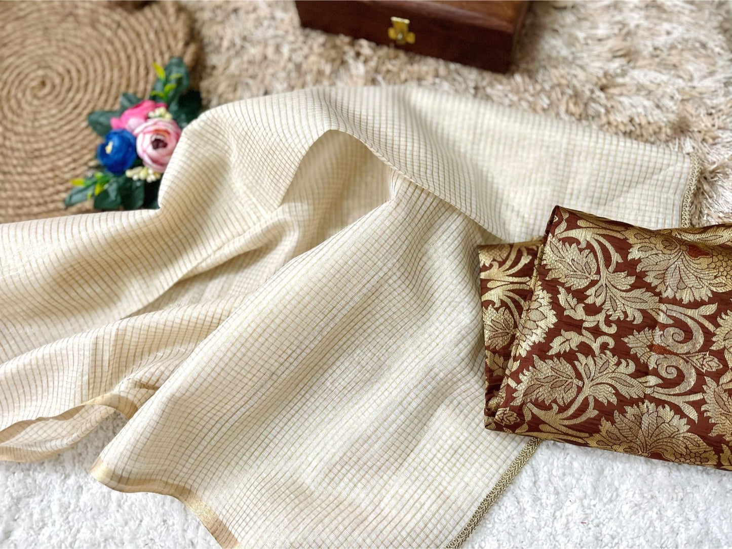 Beautiful semi chanderi silk saree with gold zari checks paired with brown Banarasi brocade blouse