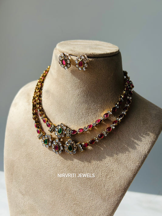 A dual-layered kundan necklace adorned with ruby and emerald