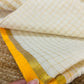 Pure and authentic mul cotton saree with zari checks all over and small mango yellow zari border