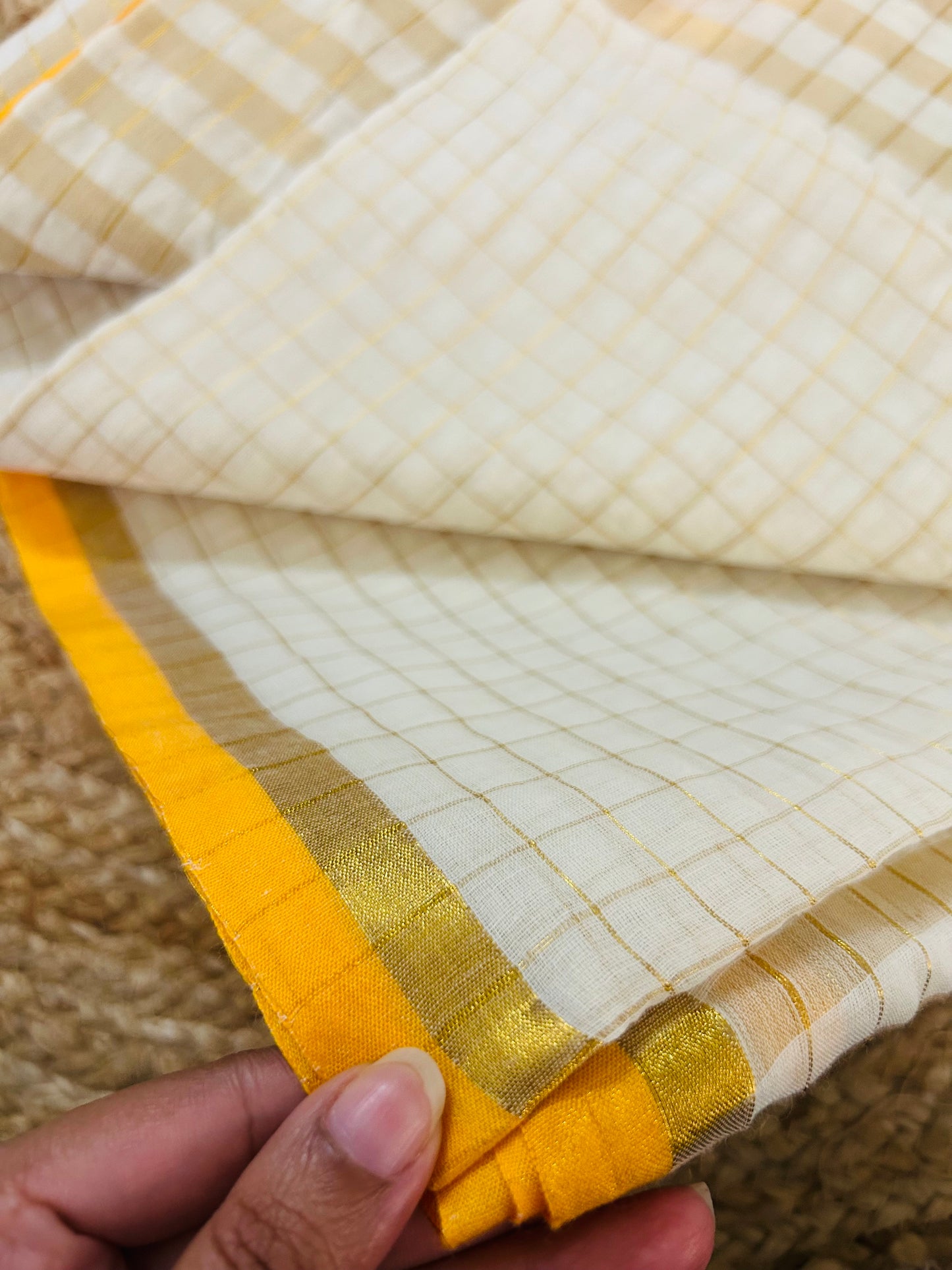 Pure and authentic mul cotton saree with zari checks all over and small mango yellow zari border