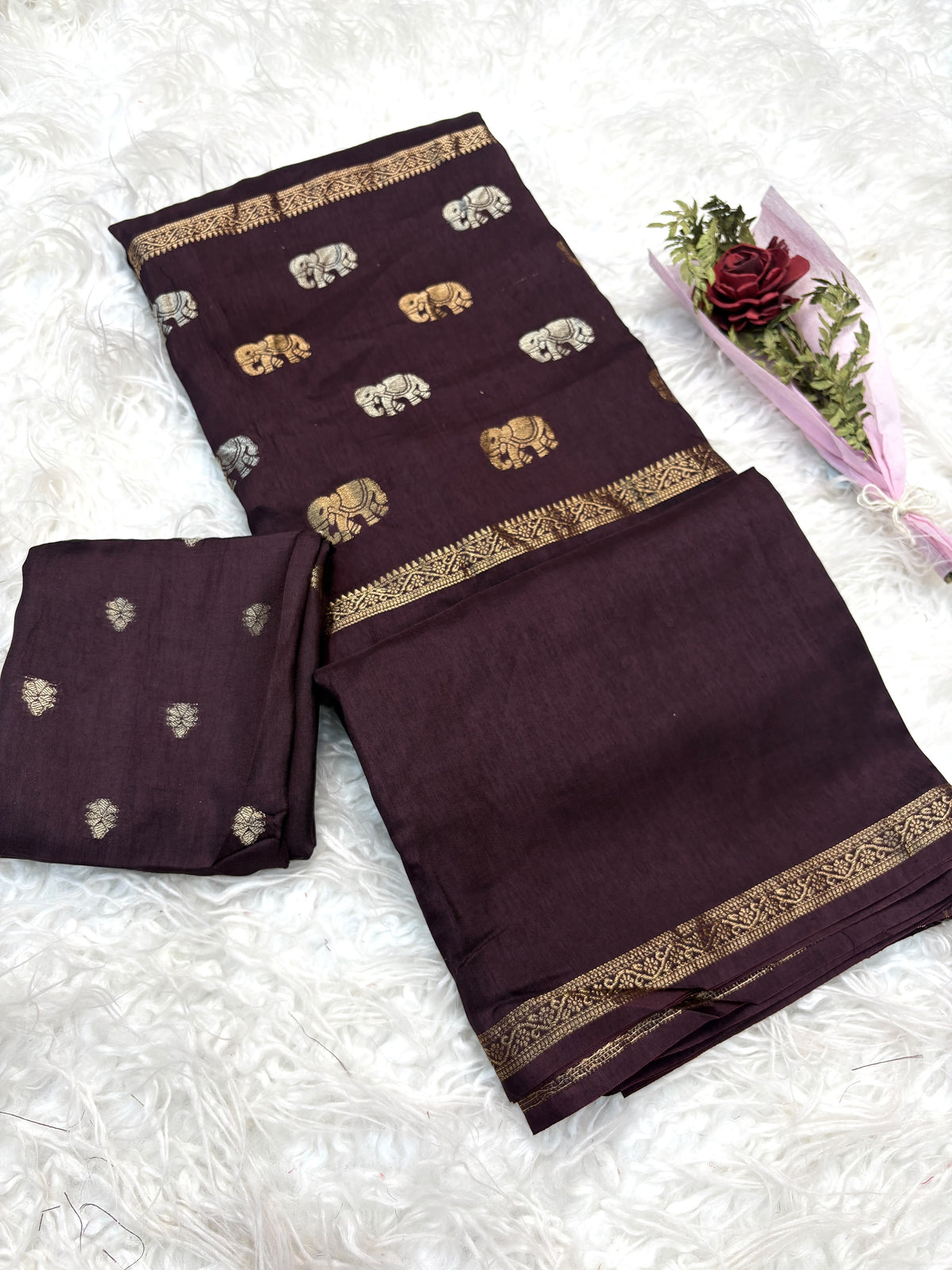 Soft viscous dola silk with beautiful silver and gold elephant motifs in the middle