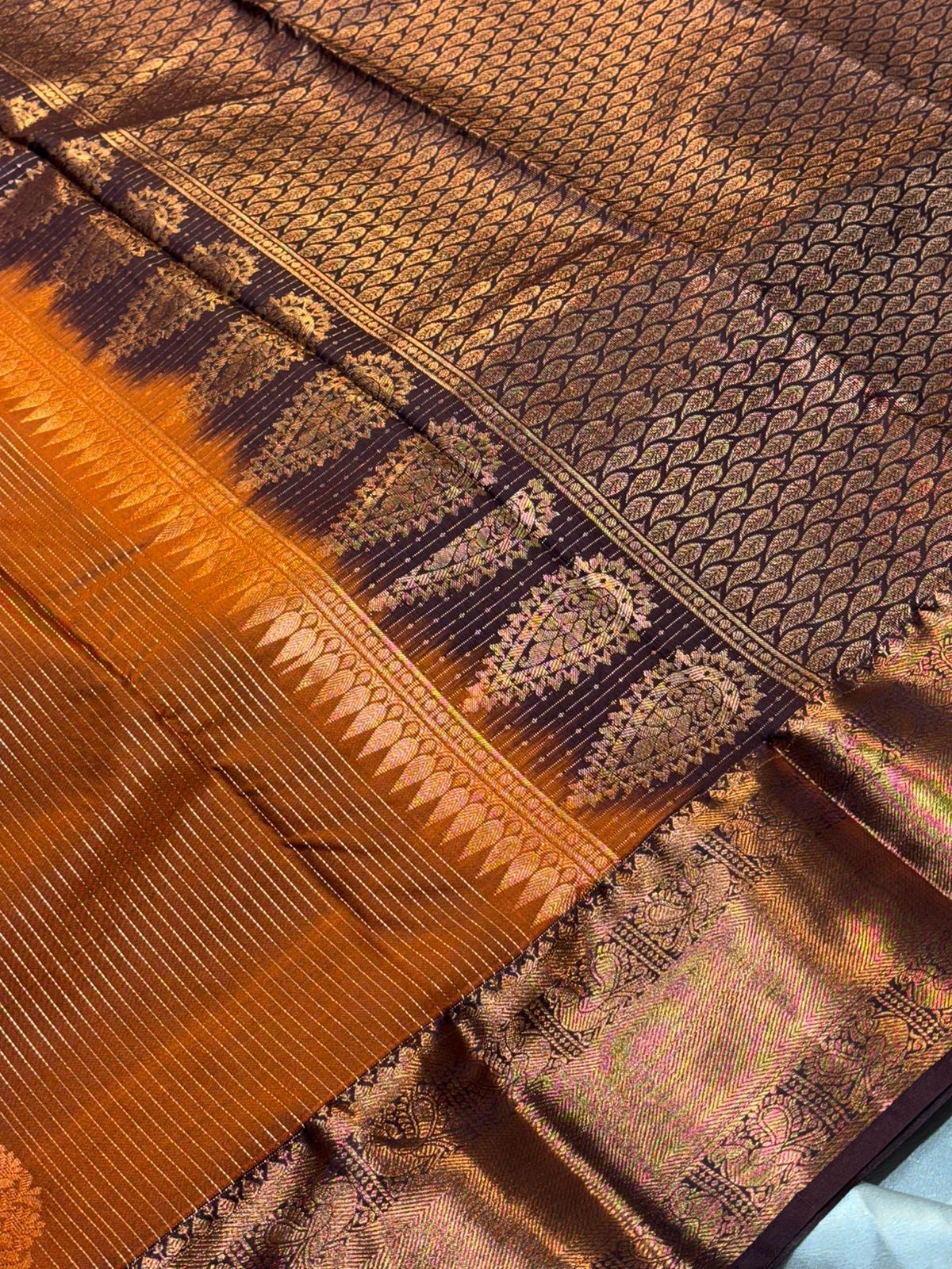 Beautiful premium rust orange semi silk saree with copper zari stripes and border