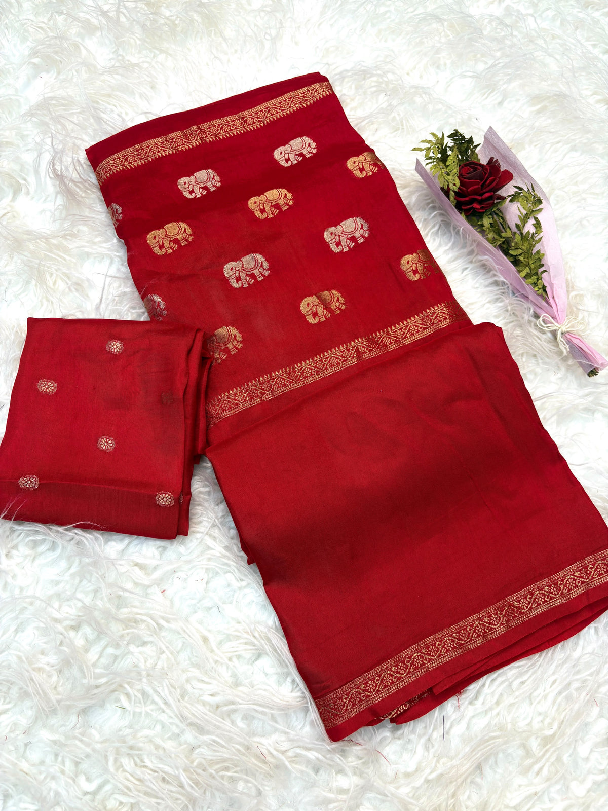Soft viscous dola silk with beautiful silver and gold elephant motifs in the middle